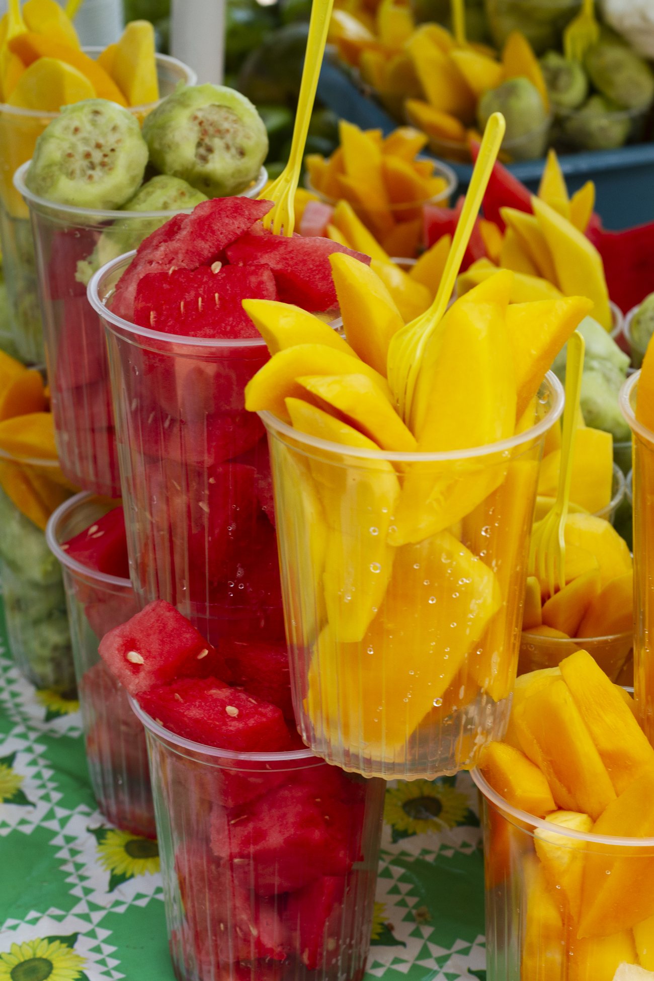 Freshly cut fruit cups on display